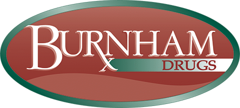 Burnham Drugs logo: white 'BURNHAM' text on a red oval with a green border and a teal stripe reading 'DRUGS', featuring an 'X' between the words.