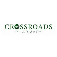 Crossroads Pharmacy logo with green text and a globe icon in the O
