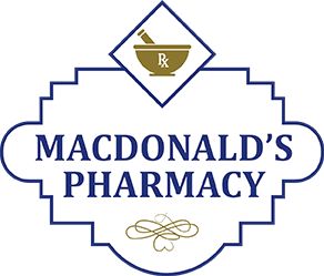 MacDonald’s Pharmacy logo: blue text on a white shield badge with a gold mortar-and-pestle symbol above and Rx motif at the top.