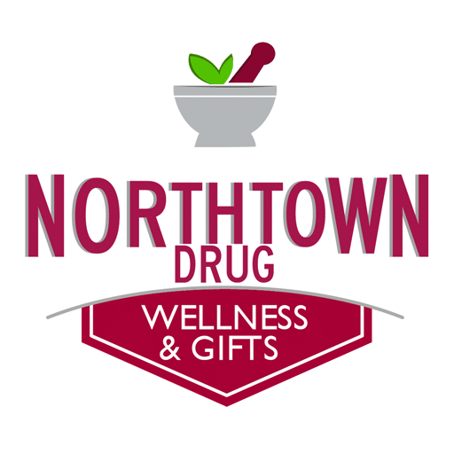 Logo for Northtown Drug Wellness & Gifts: mortar and pestle with a green leaf above magenta 'NORTHTOWN DRUG' text and a burgundy shield stating 'WELLNESS & GIFTS'.
