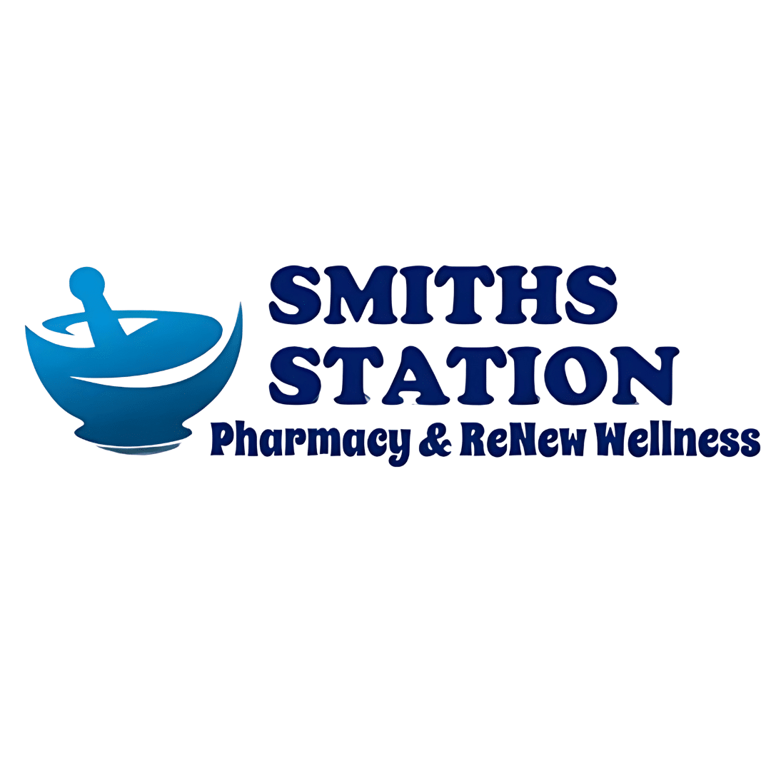 Logo for Smiths Station Pharmacy & Renew Wellness with a blue mortar-and-pestle icon on the left and bold blue text on the right.