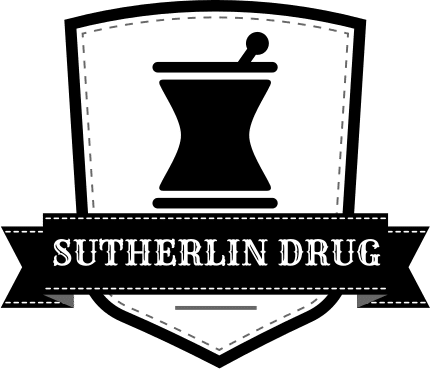 Logo for Sutherlin Drug pharmacy featuring a shield badge and mortar-and-pestle icon on a black ribbon with white text.